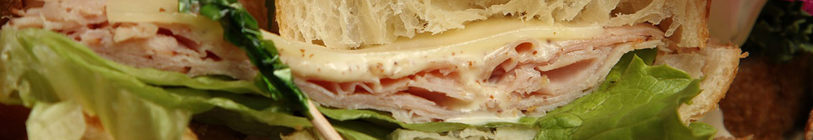 Eating Deli Sandwich at Hershey's Subs Deli & Catering restaurant in Westfield, NJ.
